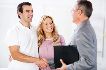 Couple meeting with financial advisor.