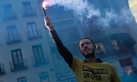 A demonstrator in T-shirt saying ‘youth without future’ protesting in Madrid