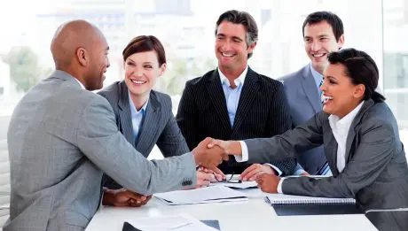 Multi-ethnic business people greeting each other