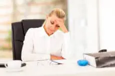 middle aged businesswoman looking worried