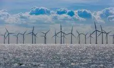 The world’s biggest offshore wind farm is to be built in British waters after its developer said it planned to charge consumers higher prices for some of its electricity.