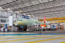 Airbus is facing the prospect of a global production slowdown after workers at its flagship UK site voted overwhelmingly to strike in a dispute over pay.