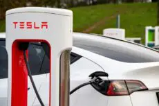 Tesla has almost halved the cost of leasing its electric cars in Britain, in a bid to reverse sliding sales and shore up its market share against fast-growing Chinese competitors.