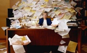 desk_with_mile_high_paper_cropped