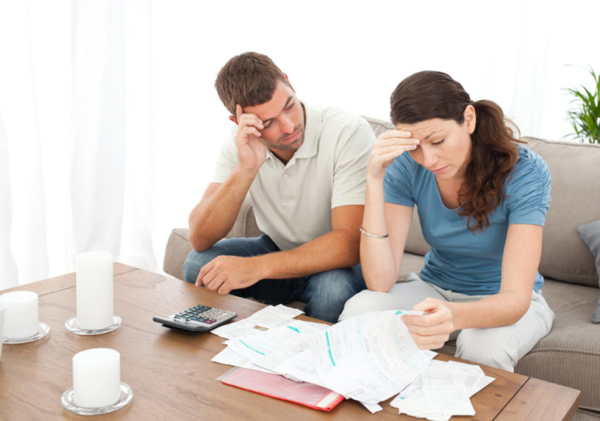 Worried couple doing their accounts