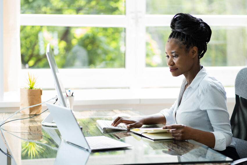 Happy,Professional,Woman,Employee,Using,Computer,For,Work