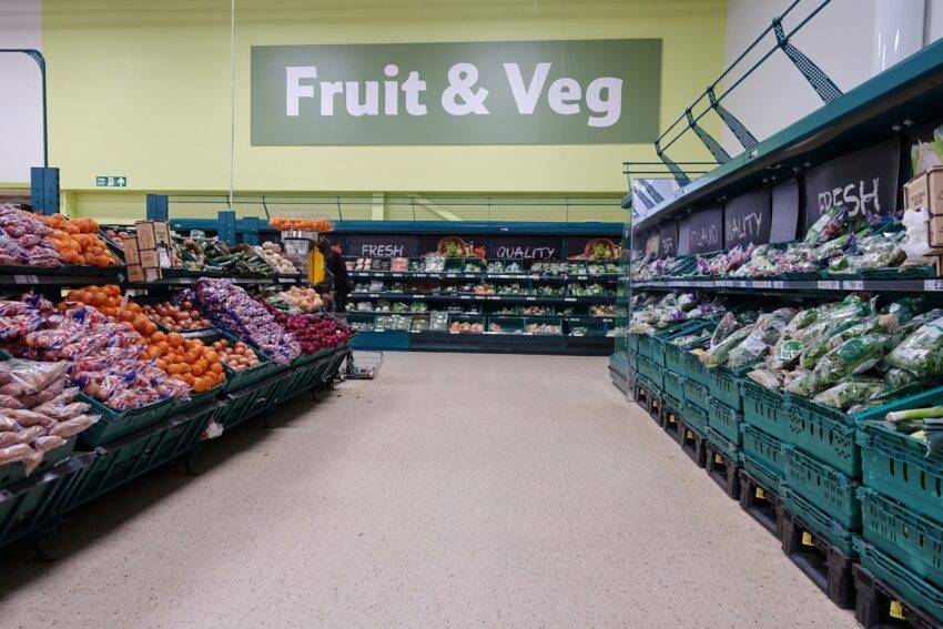 Independent shopkeepers have accused Tesco of undercutting them by selling products for less in its stores compared to its wholesale business, Booker, raising concerns about Tesco's dominance in the grocery market and its impact on local retailers.